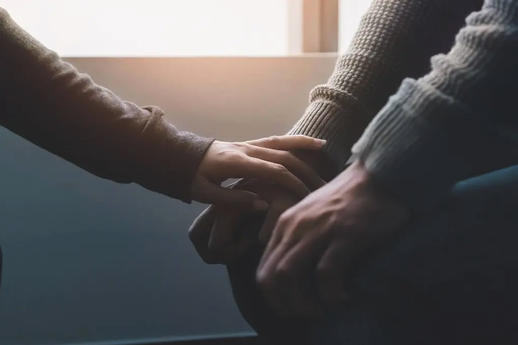 Close-up of two people's hands